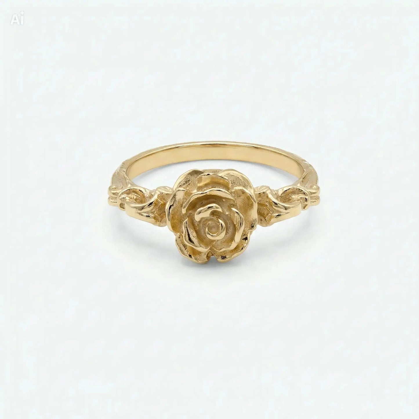 Vista frontale di un anello in bronzo dorato con rosa fiorita finemente incisa, gioiello floreale elegante con gambo decorato, ideale per fidanzamento o regalo